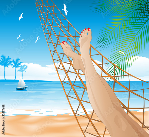 Woman lying in the hammock on the beach