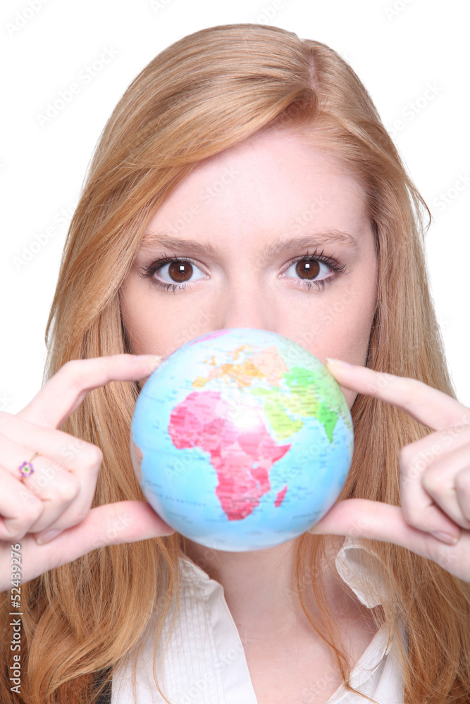 young woman showing a little globe young woman showing a little globe