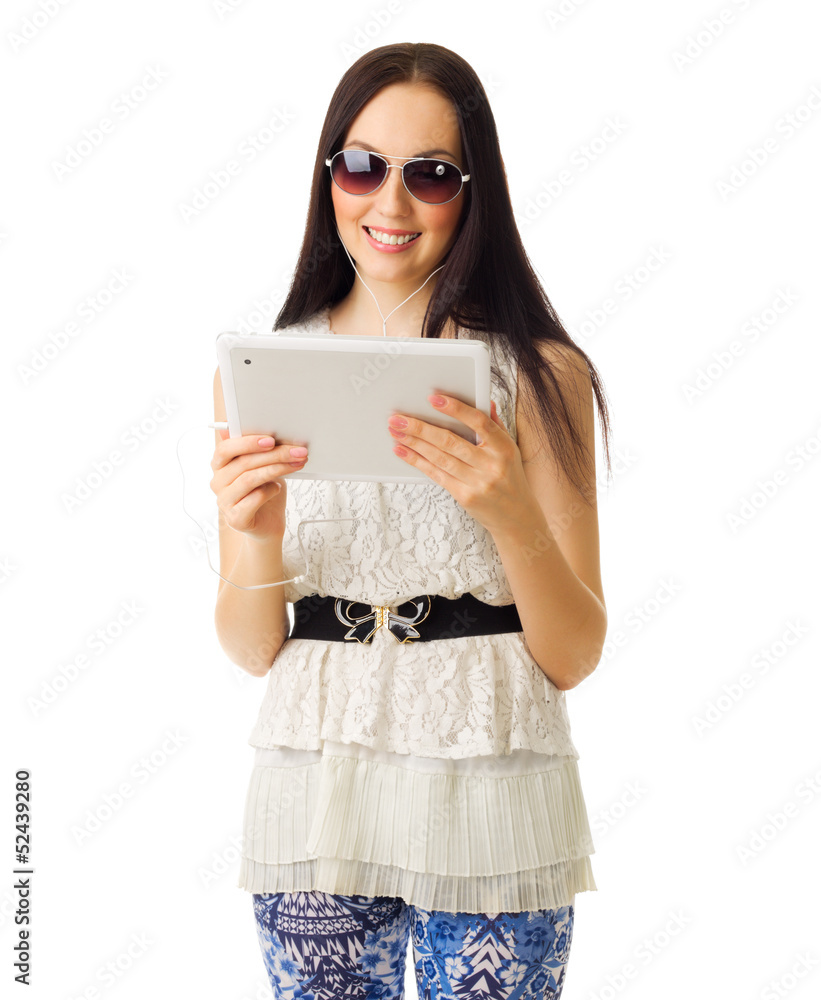 Girl in sunglasses and blue pants with tablet PC Girl in sunglasses and blue pants with tablet PC