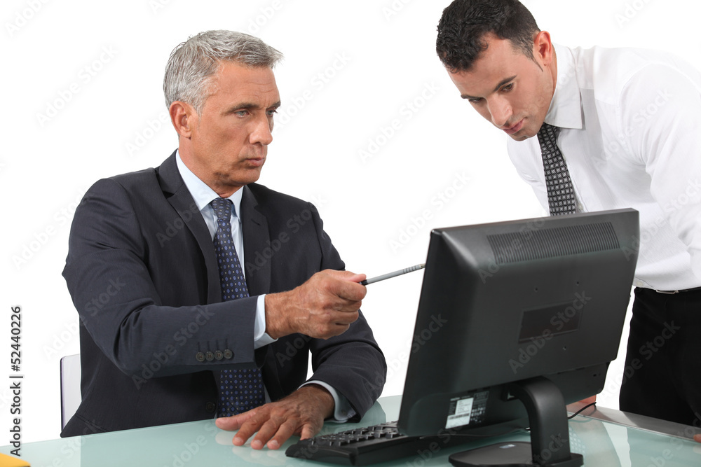 businessman giving explanations to his boss businessman giving explanations to his boss