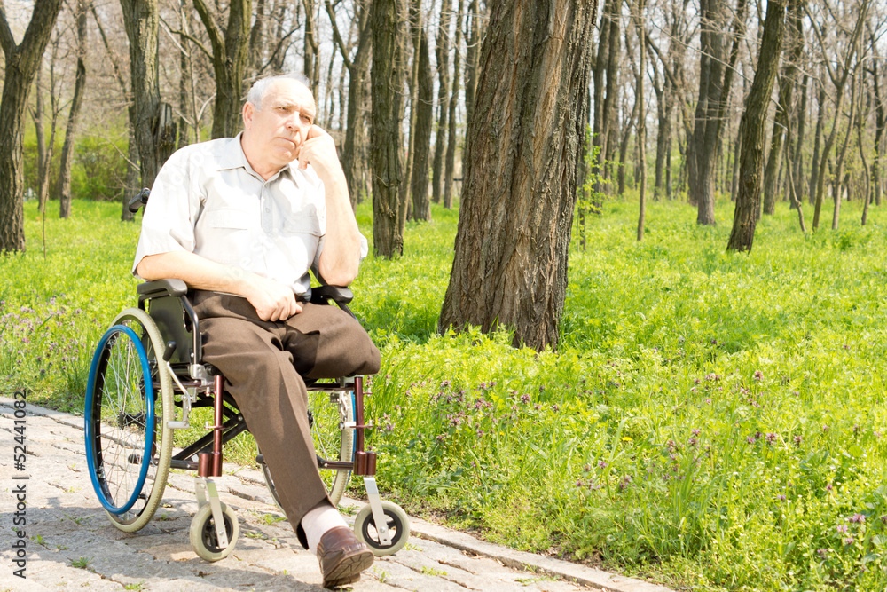 Pensive elderly amputee