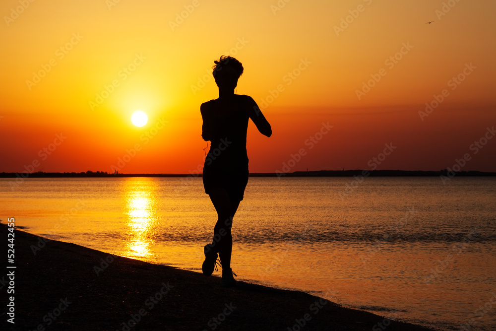 young girl runs along the sea coast