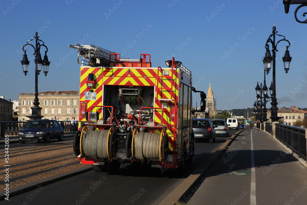 Fire engine driving over a bridge