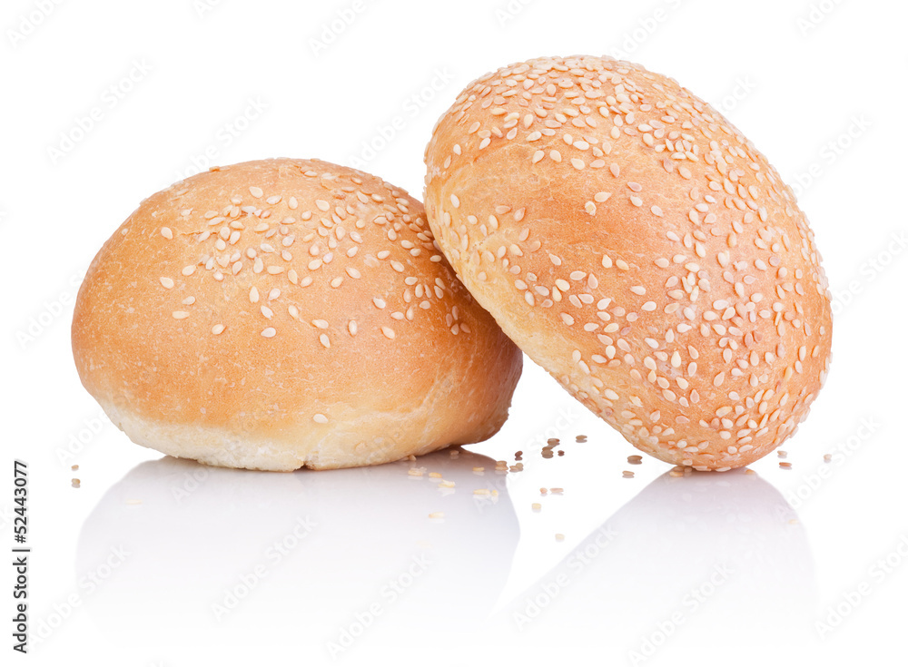 Two Round sandwich bun with sesame seeds isolated on white backg Two Round sandwich bun with sesame seeds isolated on white backg
