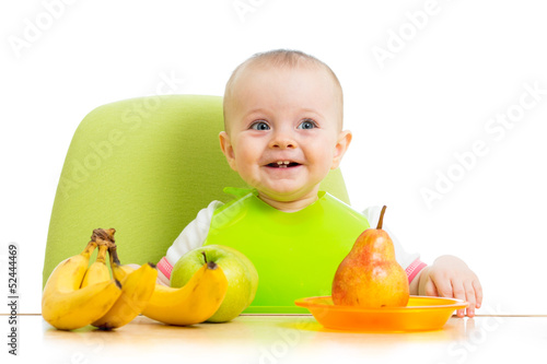 happy baby eating fruits