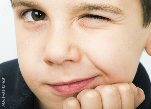 Obraz na płótnie Little boy wink of an eye