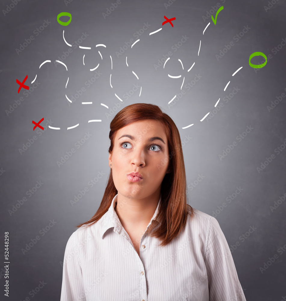 Young woman thinking with abstract marks overhead Young woman thinking with abstract marks overhead