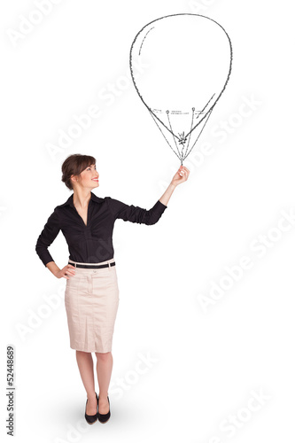 Pretty woman holding balloon drawing