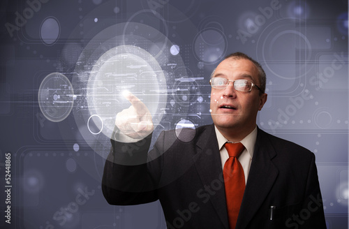 Businessman touching abstract high technology circular buttons