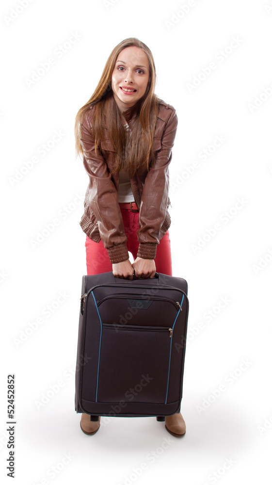 woman lifts a heavy suitcase, isolated on white background woman lifts a heavy suitcase, isolated on white background