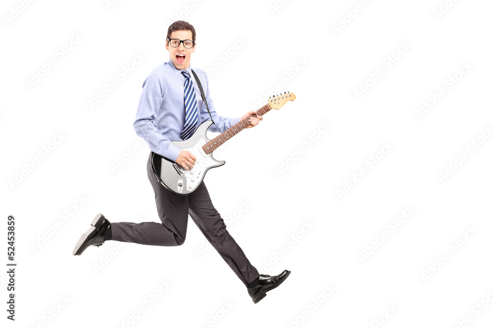 Full length portrait of energetic young male jumping with a guit Full length portrait of energetic young male jumping with a guit
