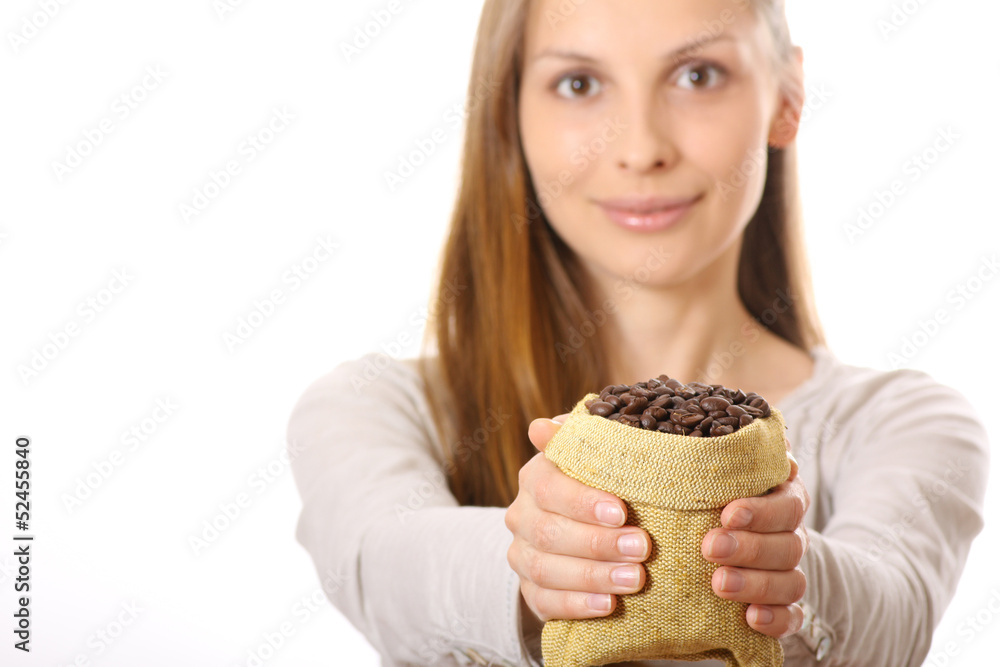 young woman holding a small bag of coffee beans young woman holding a small bag of coffee beans