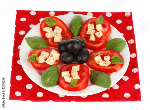 Cheese mozzarella with vegetables in the plate isolated on photo