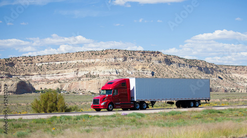 фотографія Semi-truck on the road in the desert