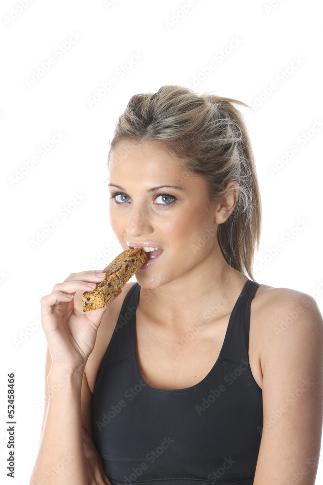 Model Released. Young Woman Eating Energy Cereal Bar Model Released. Young Woman Eating Energy Cereal Bar