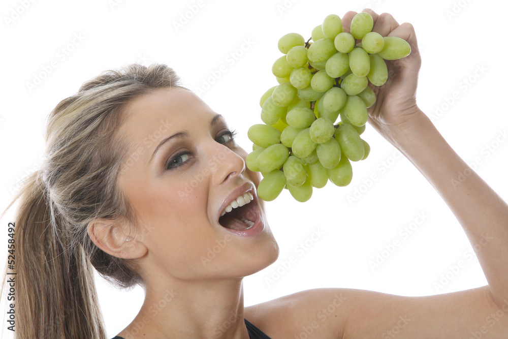 Model Released. Young Woman Holding a Bunch of Grapes Model Released. Young Woman Holding a Bunch of Grapes