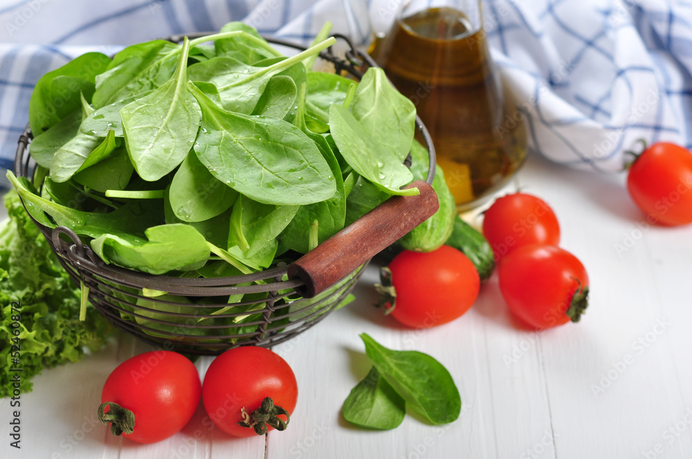 Fresh spinach leaves in basket Fresh spinach leaves in basket