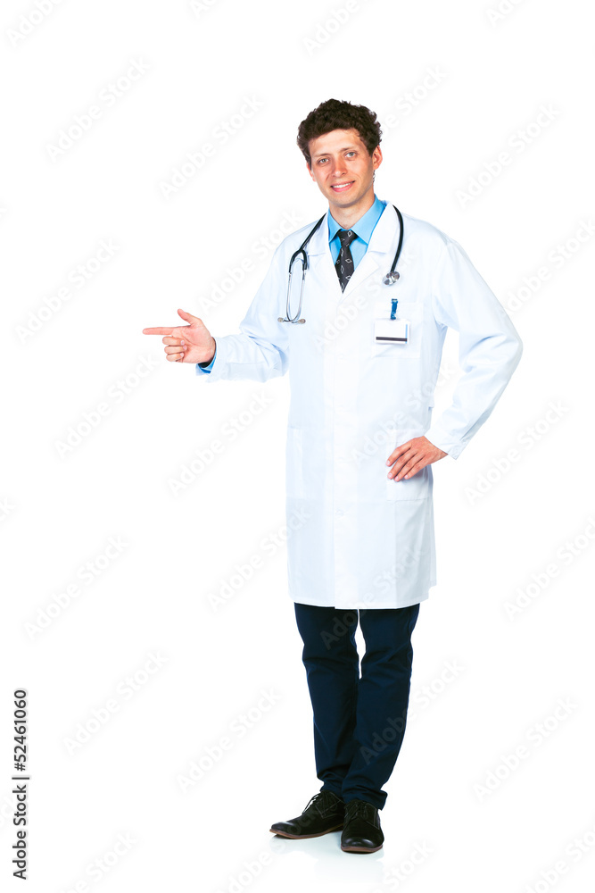 Portrait of a smiling young male doctor pointing sideways isolat Portrait of a smiling young male doctor pointing sideways isolat