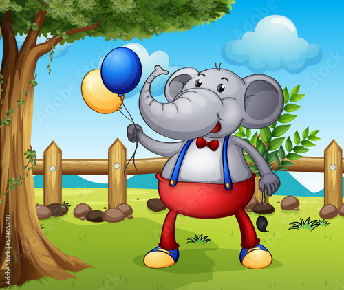 An elephant holding balloons