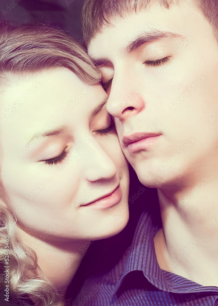 Closeup faces of loving couple Closeup faces of loving couple