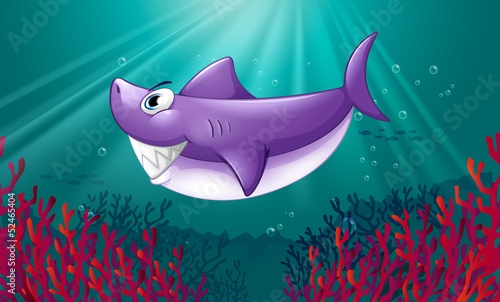 A smiling violet shark under the sea