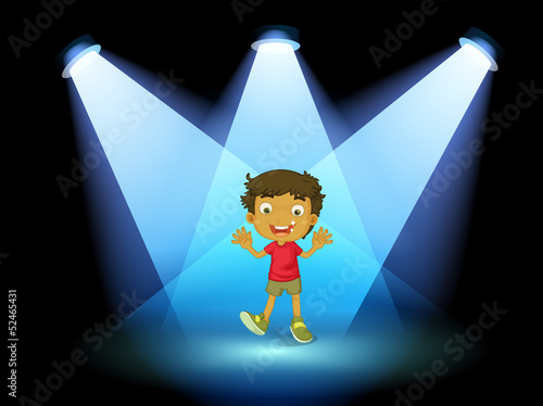 A little kid at the center of the stage