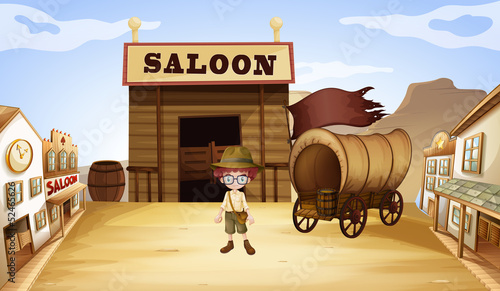 A young boy in front of a saloon bar