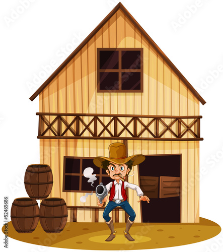 A man holding a gun near the barrels