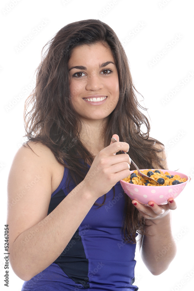 Model Released. Young Woman Eating Breakfast Cereal Model Released. Young Woman Eating Breakfast Cereal