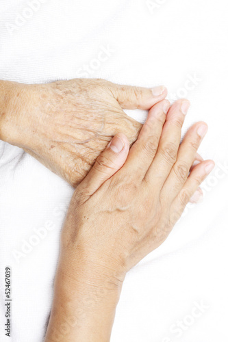 woman hand putting on her mother hand