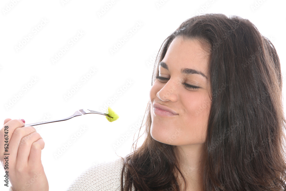 Model Released. Young Woman Eating Fresh Fruit Salad Model Released. Young Woman Eating Fresh Fruit Salad