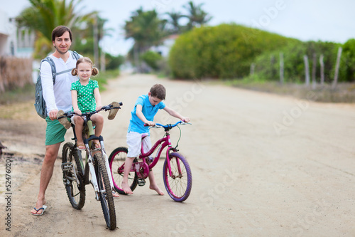 Father and kids on bikes