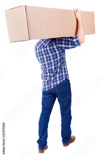 Young man walking with card box, isolated on white