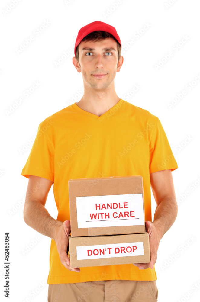 Young delivery man holding parcels, isolated on white Young delivery man holding parcels, isolated on white