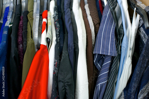 Close up of clothing, red shirt on left