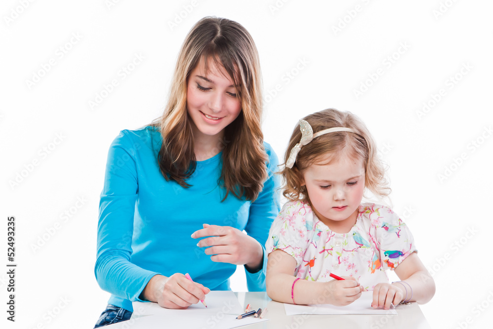 two beautiful girls draw with pencils two beautiful girls draw with pencils