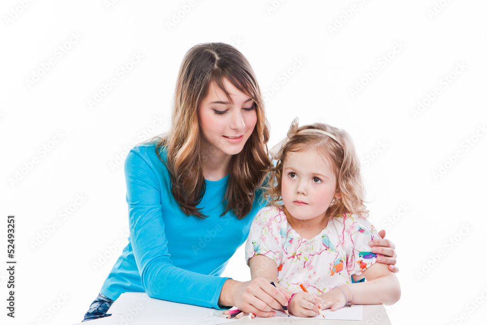 two beautiful girls draw with pencils two beautiful girls draw with pencils