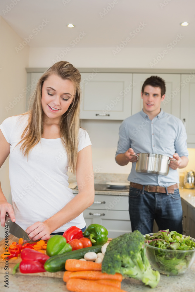 Young couple preparing dinner