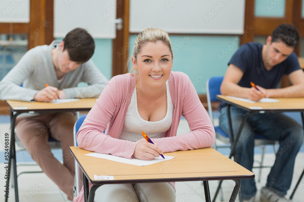 Fototapeta premium Writing students in a classroom