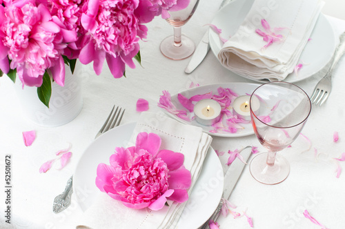 festive table setting with pink peonies