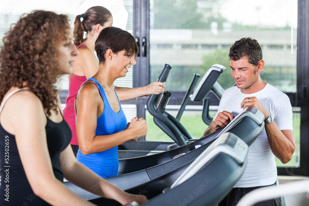 People Running on Treadmill in the Gym People Running on Treadmill in the Gym