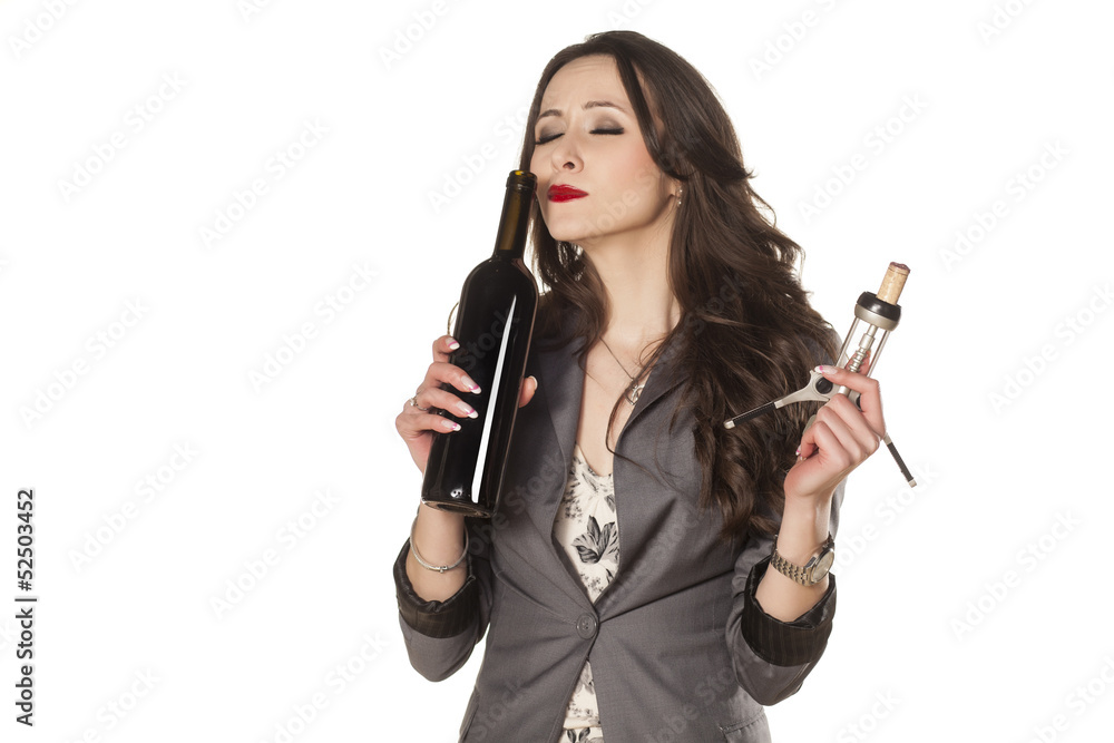 nice woman smells the wine from the bottle nice woman smells the wine from the bottle