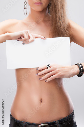 Beautiful, female torso with a sign