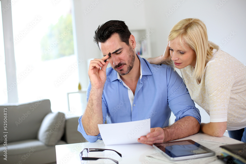 Middle-aged couple working from home