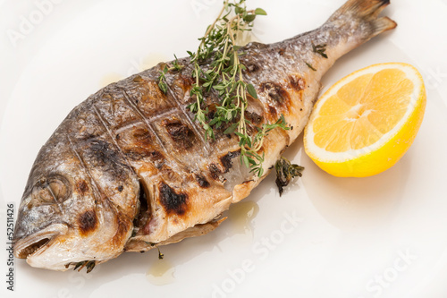 close-up hot dish grilled dorado with lemon