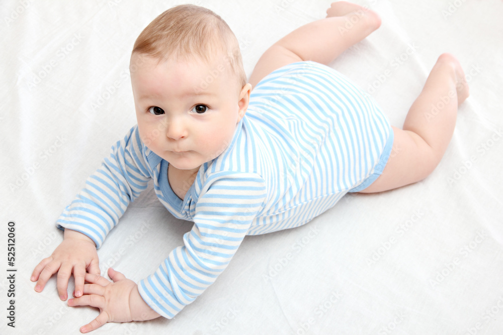 Baby boy lies on bed Baby boy lies on bed