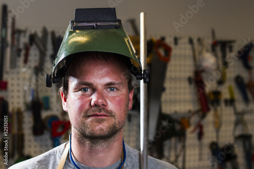 welder wearing helmet at work place