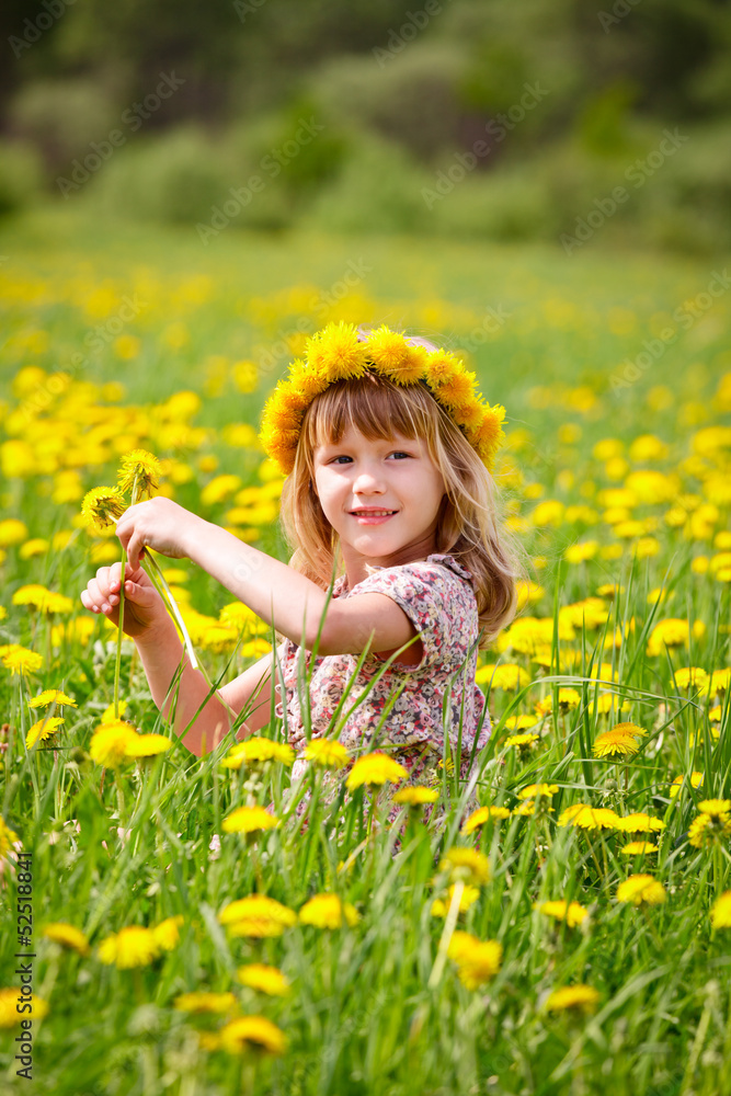 Cute little girl wearing floral wreath outdoors Cute little girl wearing floral wreath outdoors