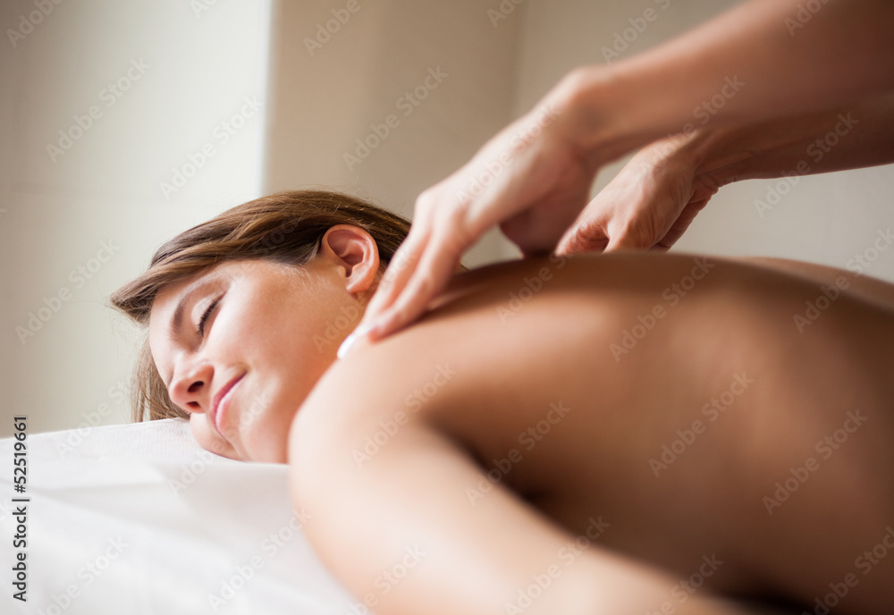 Woman having a massage in a spa Woman having a massage in a spa