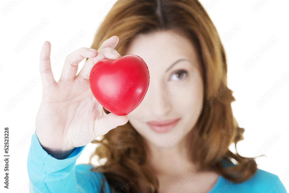 Attractive smiling woman showing red heart Attractive smiling woman showing red heart